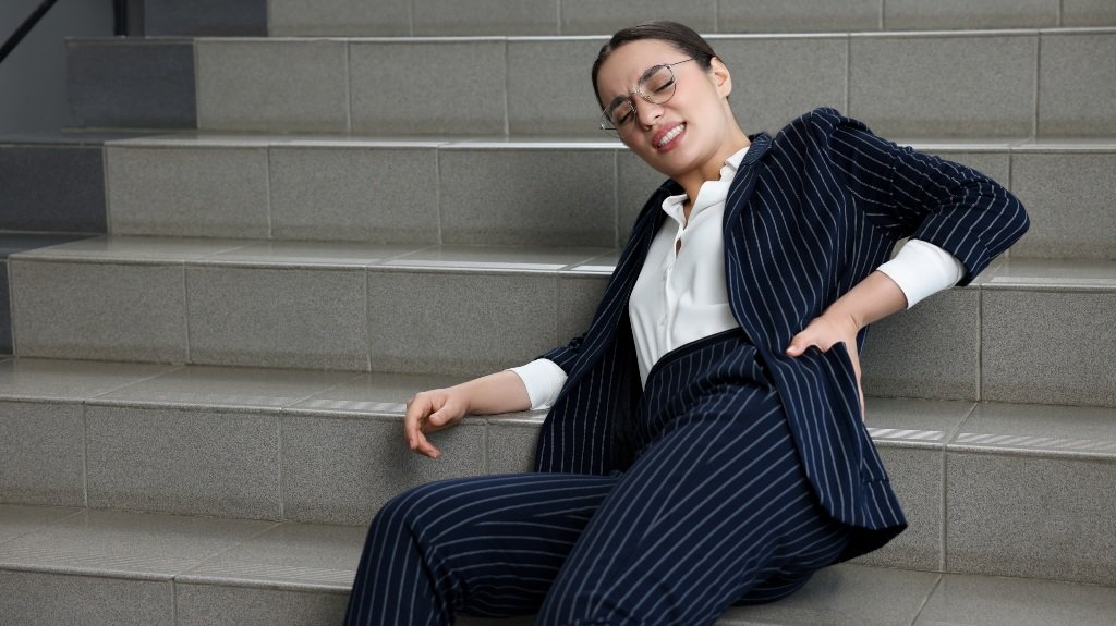 woman experiences back pain after fall woman experiences back pain after fall