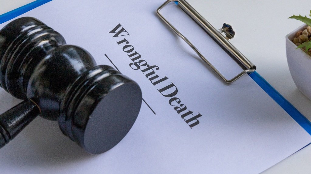 wrongful death document in a clipboard with a judge’s gavel on a desk_s wrongful death document in a clipboard with a judge's gavel on a desk
