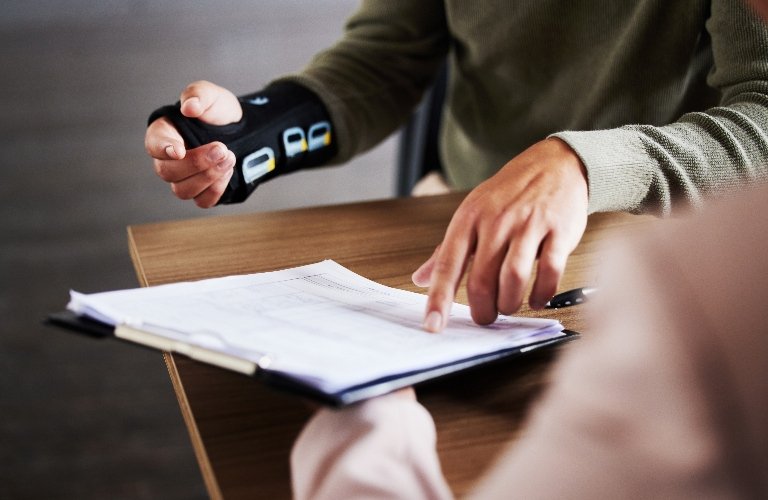 Injured Client Discussing Comparative Fault Case With Lawyer