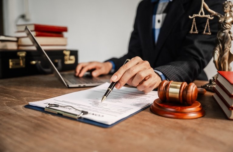 Attorney reviewing legal documents related to an Illinois personal injury claim.