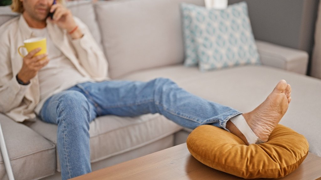 Young man with an injured foot after slip and fall accident