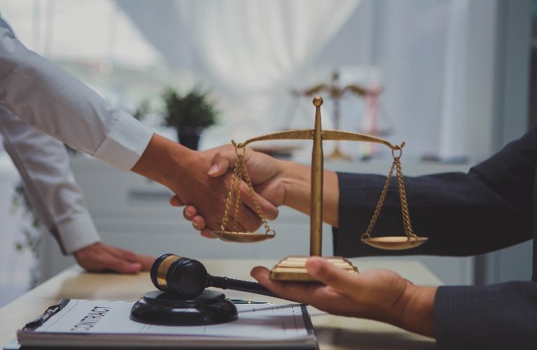 Lawyer and client are shaking hands