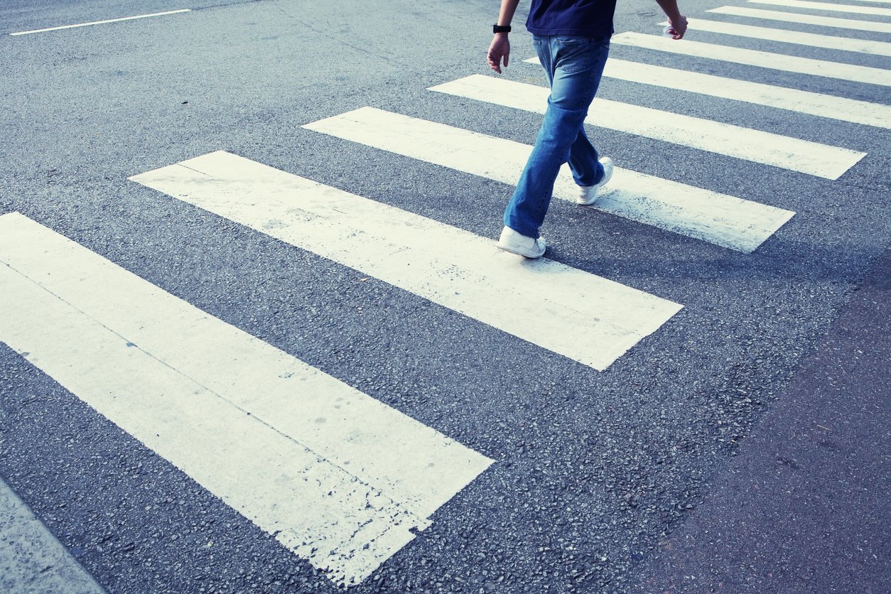 Pedestrian crossing a crosswalk at an Illinois intersection